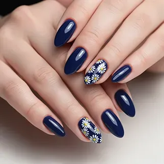 Hands displaying glossy, dark navy blue nails, with the ring fingers featuring accent nail art of small, hand-painted white and yellow daisies