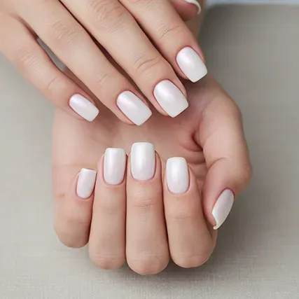 Close-up of a professional signature manicure with a neutral polish.